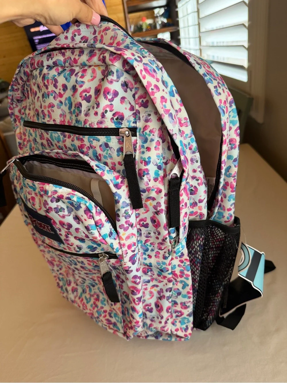 JanSport Backpack in White with Pink & Blue Leopard Print